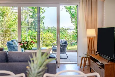 a living room with a couch and a television at 2 Bed in Padstow oc-h32002 in Padstow