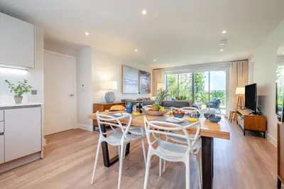 a kitchen and living room with a table and chairs at 2 Bed in Padstow oc-h32002 in Padstow