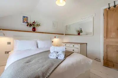 a bedroom with a bed with two towels on it at 5 Bed in Tredethy oc-t31962 in Saint Mabyn