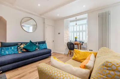 a living room with a couch and a table at 2 Bed in Padstow oc-f32031 in Padstow