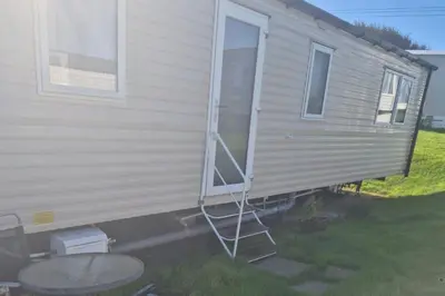 a ladder on the side of a mobile home at Newquay - Pet Friendly 6 Berth Caravan in Newquay