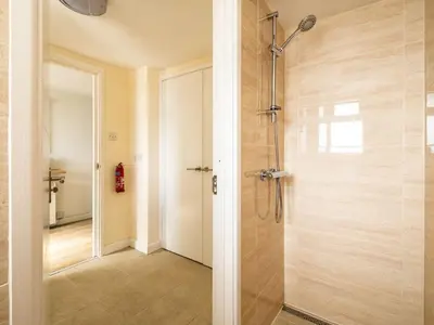 a shower with a glass door in a bathroom at 6 Slipway in Padstow