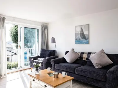 a living room with a couch and a table at 6 Slipway in Padstow