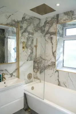 a bathroom with a white tub and a sink at Palm Haven House - Luxury family-friendly Newquay surf house near Porth Beach perfect for walking, pets, exploring in Newquay