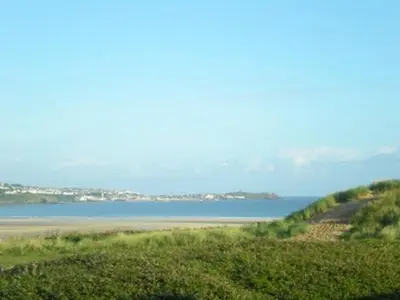a view of a body of water with the horizon at Sunset Sea Views 1 min to beach On SW Coast Path Private Parking in Uny Lelant