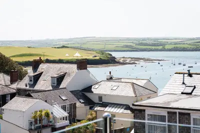 an aerial view of houses and a body of water at 17 Slipway in Padstow
