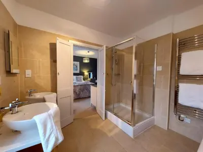 a bathroom with a sink and a shower at Boscastle House in Boscastle