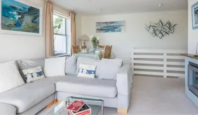 a living room with a couch and a table at 23 Slipway in Padstow