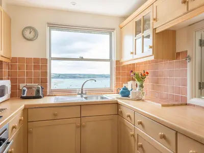 a kitchen with a sink and a window at 23 Slipway in Padstow