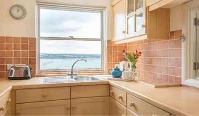 a kitchen with a sink and a window at 23 Slipway in Padstow
