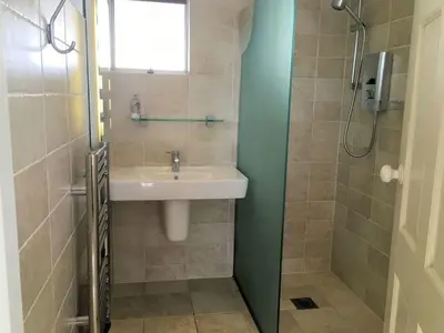 a bathroom with a sink and a shower at 23 Slipway in Padstow