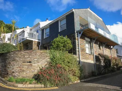 a large house with a brick wall at 23 Slipway in Padstow