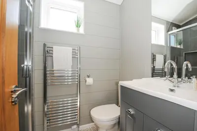 a bathroom with a toilet and a sink at 17 Meadow Retreat in Liskeard