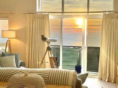 a living room with a view of the ocean at Penthouse at Bredon in Newquay
