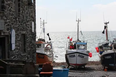 a group of boats are parked on the beach at Old Temperance House in Saint Keverne