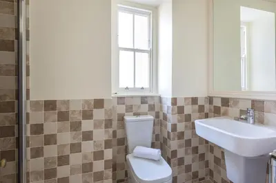 a bathroom with a toilet and a sink at 5 The Terrace in Padstow