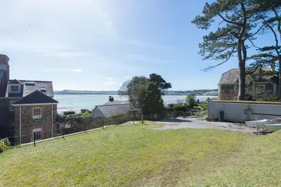a view of the water from the backyard of a house at 5 The Terrace in Padstow