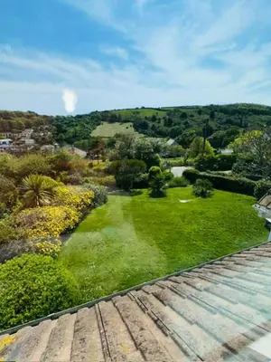 an aerial view of a yard with grass and trees at Moogara in Gorran Haven