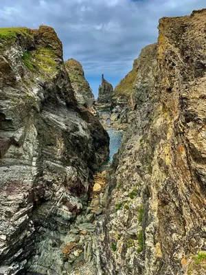 a view of a river between two rocky cliffs at Family-Friendly 3-Bed Caravan Recently Renovated on Seven Bays Holiday Park, Padstow in St Merryn