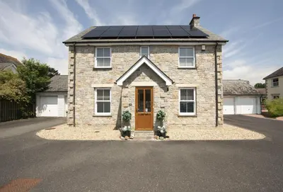 a house with a solar panel on top of it at Puffin Way in Hayle