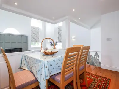 a kitchen with a table with a basket on it at Trelowth Chapel in St Austell