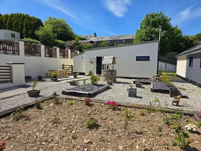 a garden with some plants in a yard at Acklington 2 bedroom property in Menheniot