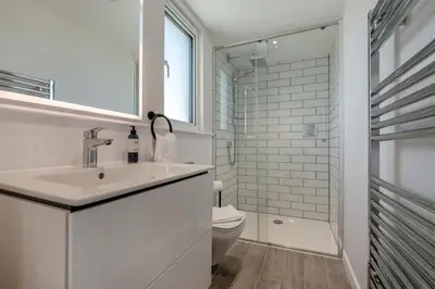 a white bathroom with a sink and a toilet at 4 Bed in St. Merryn oc-f31095 in St Merryn