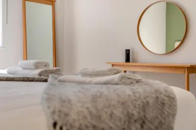 a room with a mirror and a table with towels at 4 Bed in St. Merryn oc-f31095 in St Merryn