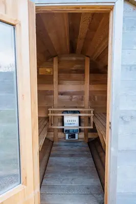 an inside view of a sauna in a tiny house at 5 Star Large Farmhouse Near The Beach With Hot Tub & Sauna - Porth, Near Newquay in Saint Columb Minor