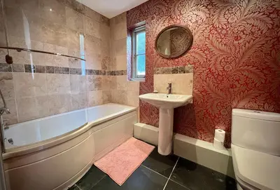 a bathroom with a tub and a sink and a toilet at Old Chapel House in Tintagel