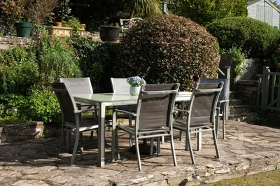 a table and four chairs sitting around a table at Honeysuckle Cottage in Saint Minver