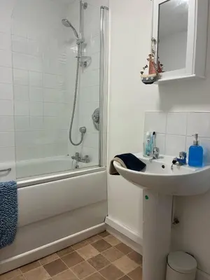 a bathroom with a sink and a shower and a tub at The perfect bolt hole in Quethiock