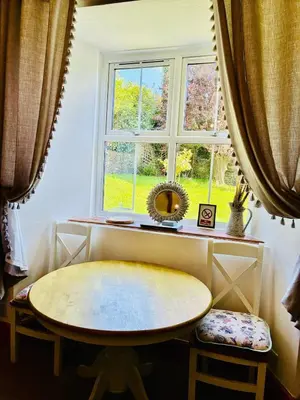 a room with a table and a window at The perfect bolt hole in Quethiock