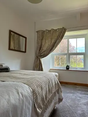 a bedroom with a bed and a window at The perfect bolt hole in Quethiock