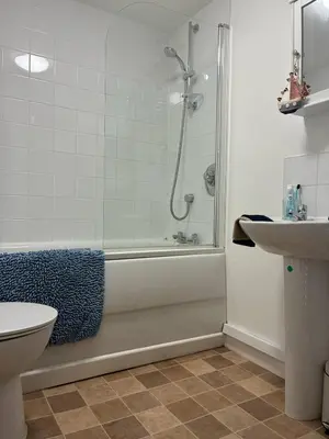 a bathroom with a shower and a toilet and a sink at The perfect bolt hole in Quethiock