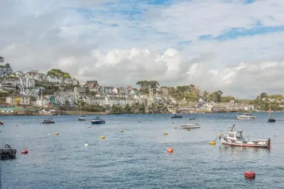 a group of boats in a large body of water at 2 Bed in Polruan oc-w31943 in Fowey