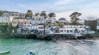 a group of houses on the shore of a body of water at 2 Bed in Polruan oc-w31943 in Fowey