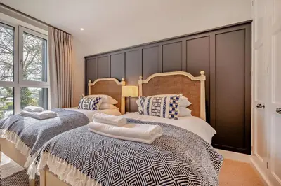 two beds sitting next to each other in a bedroom at 2 Bed in Padstow oc-h29015 in Padstow