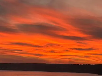 a sunset over a body of water at Ocean View at Kenwyn in Torpoint