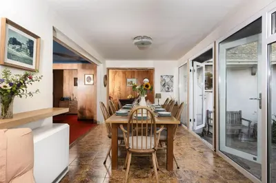 a dining room with a table and chairs at Little Rabbit Hill in Polzeath