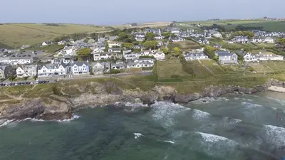 an aerial view of a village on the coast at Little Rabbit Hill in Polzeath