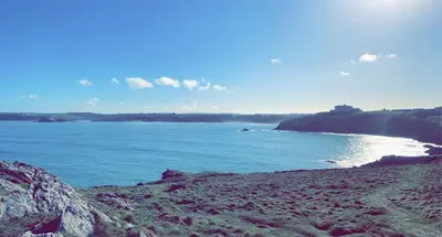 a view of the ocean from a rocky beach at Apartment Close To Porth Beach in Saint Columb Minor
