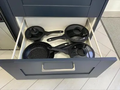 a drawer with some utensils in it at Apartment Close To Porth Beach in Saint Columb Minor