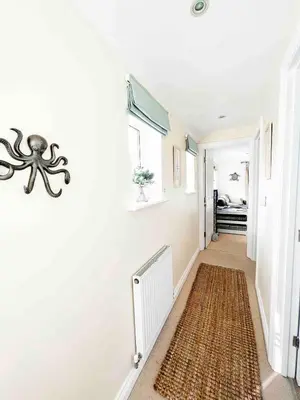 a hallway with an octopus decoration on the wall at MINSTER DREAMS - A perfect seaside retreat for couples near Porthminster beach in St Ives