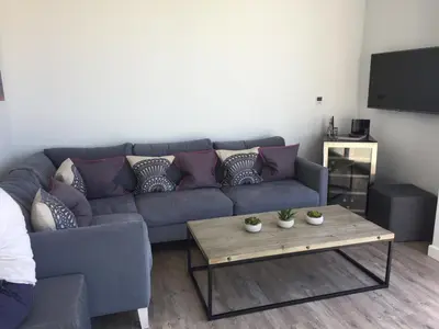 a living room with a couch and a coffee table at Cliff House in Padstow