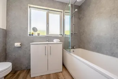 a bathroom with a sink and a tub and a toilet at 3 Bed in Newquay oc-c30862 in Newquay