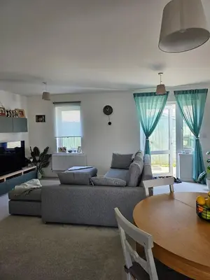 a living room with a couch and a table at House in Cornwall in Redruth