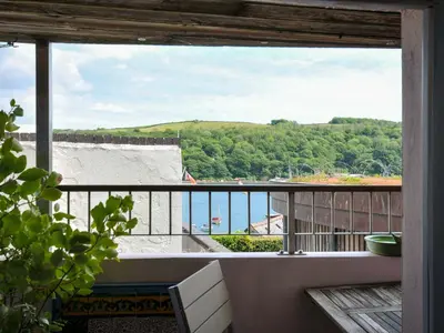 a view of the ocean from the balcony of a house at 5 Esplanade in Fowey