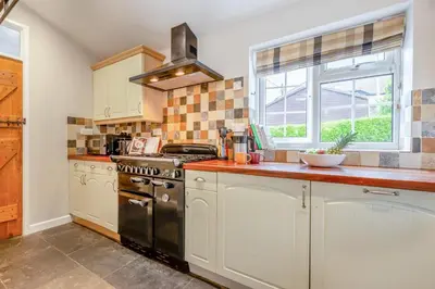 a kitchen with a stove and a window at 3 Bed in Egloshayle oc-m32201 in Egloshayle