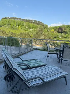 a patio with two chairs and a table on a balcony at Shorething in Saint Martin